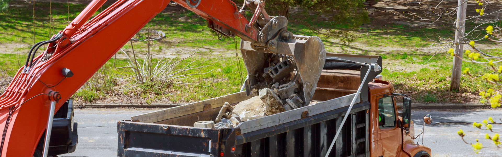 excavator collecting debris